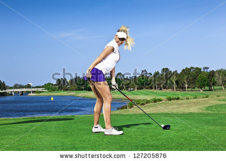 stock-photo-attractive-golfer-girl-on-golf-course-with-driver-127205876
