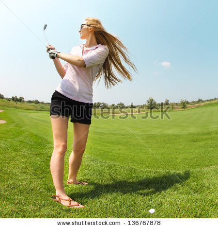 stock-photo-female-golf-player-practicing-to-hit-the-ball-at-the-course-136767878