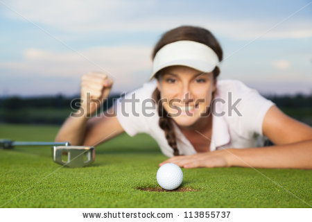 stock-photo-happy-woman-golf-player-lying-on-green-after-successful-shot-focus-on-ball-dropping-into-hole-113855737