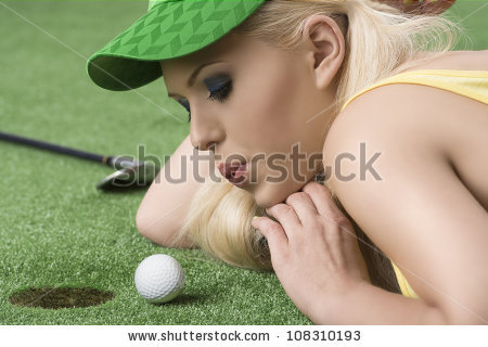 stock-photo-pretty-blonde-girl-is-lying-on-the-grass-and-playing-with-golf-ball-she-is-in-profile-looks-the-108310193
