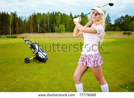 stock-photo-woman-placing-a-golf-ball-on-the-course-77779990