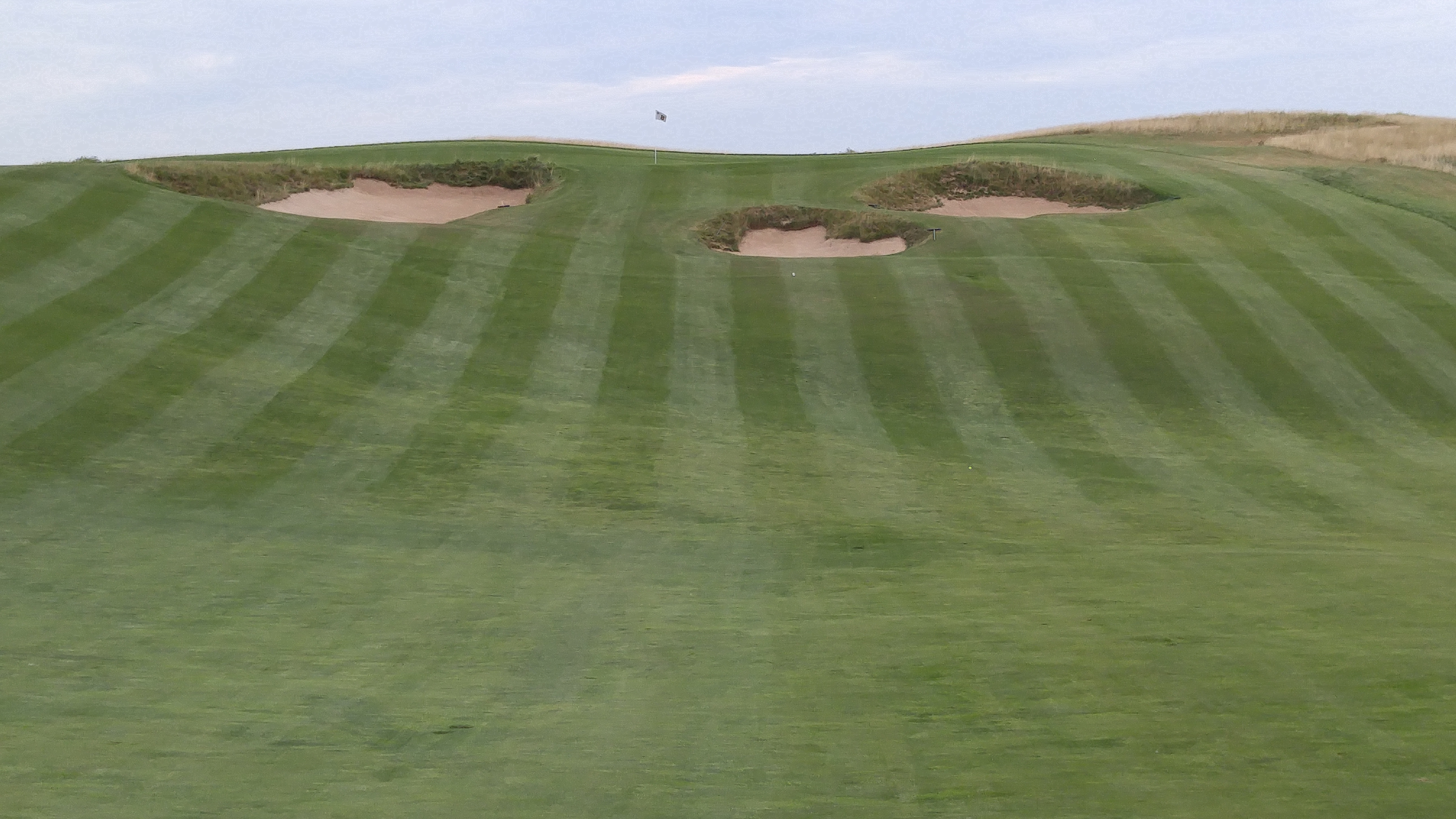 The uphill shot to the par-4 8th green at Erin Hills