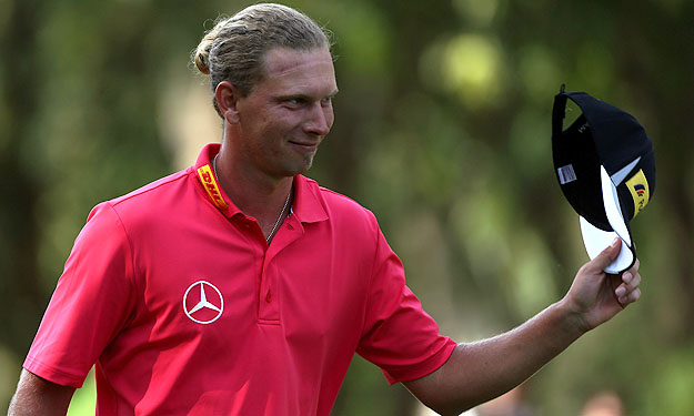 AGADIR, MOROCCO - MARCH 31:  Marcel Siem of Germany acknowledges the crowd on the 18th green after winning the Trophee du Hassan II Golf at Golf du Palais Royal on March 31, 2013 in Agadir, Morocco.  (Photo by Warren Little/Getty Images)