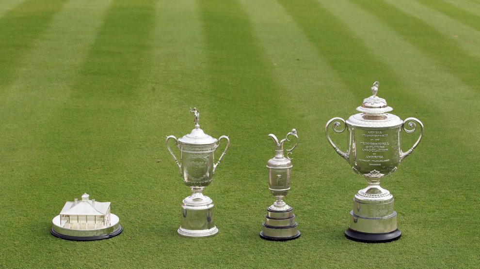 The four men's major championship trophies