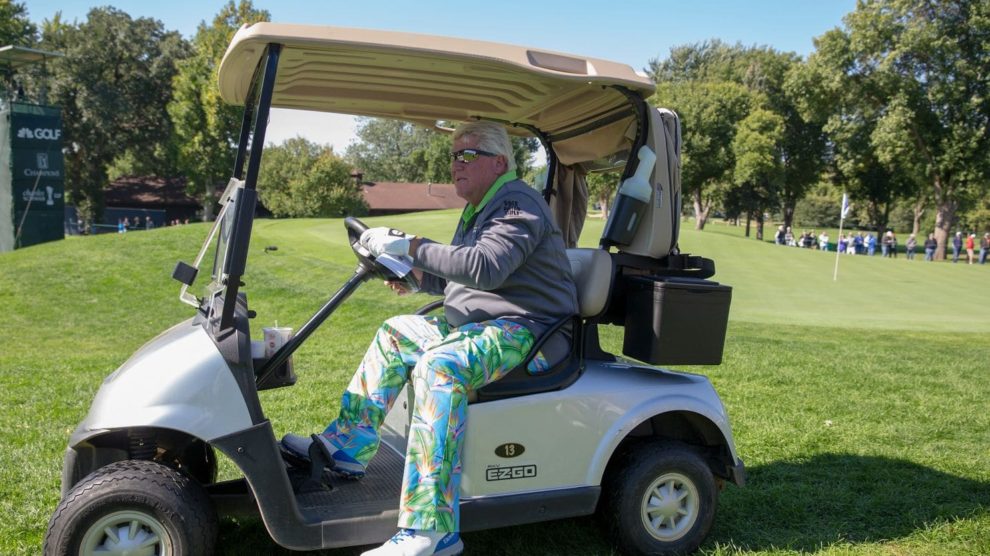 John Daly in a golf cart