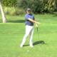 Here’s how to hit golf shots when your ball is on a downhill lie